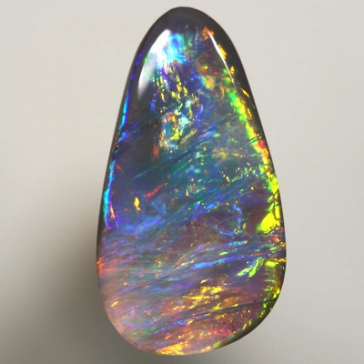 SOLID SEMI BLACK OPAL Bright golds to turquoise and blue